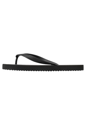 Black flip-flop sandal with rubber material, flat sole, T-shaped strap, textured accents, and scalloped edge detailing.