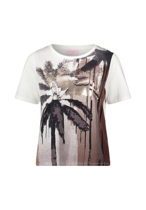 T-shirt blanc à manches courtes avec un design abstrait de palmiers marron, noir et beige, agrémenté d'accents métalliques sur le devant.