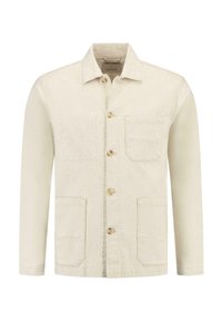 Lys beige denimjakke med lange ermer, to frontlommer og lyse treknapper. Har en klassisk krage og minimal søm.