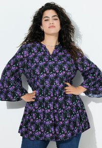 Floral blouse with long bell sleeves, featuring a black background adorned with purple flowers and green leaves, textured fabric, and a relaxed fit.