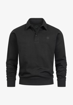 Sort langærmet polo lavet af økologisk bomuld. Har en klassisk krave, tre-knapslukning og et diskret logo på brystet.