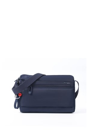 Compact navy blue crossbody bag with adjustable strap, front zipper pockets, and Hedgren brand logo on a white background.