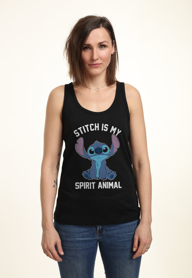 Débardeur noir avec un graphisme de Stitch, portant le texte "STITCH EST MON ANIMAL SPIRITUEL" en blanc. Matière en coton, coupe décontractée.