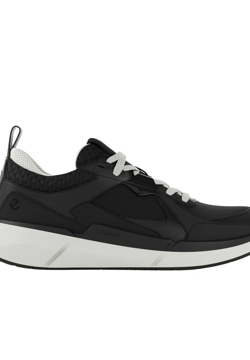 Czarne buty sportowe z teksturowaną cholewką, białymi sznurowadłami i grubą białą podeszwą. Posiadają siateczkowe wstawki oraz wzmocniony tab na pięcie.