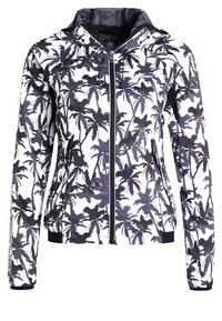 Chaqueta corta con cremallera en un patrón de hojas de palma en blanco y negro, fabricada en material ligero, con capucha y puños elásticos.
