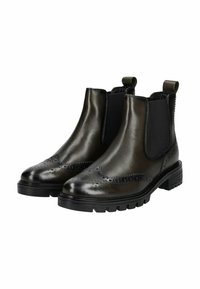 Botas Chelsea de piel negra con paneles laterales elásticos y detalles decorativos de brogue. Suelas de goma gruesas para mayor tracción.