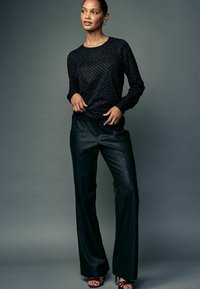 Next Pullover - black sparkle