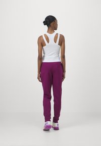 Nike Performance HERITAGE PANT - Treniņtērpa apakšdaļas - sangria