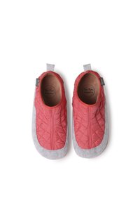 Red quilted slippers with gray fabric soles, featuring a smooth texture and a rounded design. Branding tag visible on the side.