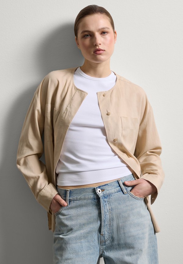 WITH POCKETS. - Bluse - light beige
