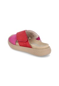 Red and pink leather slide sandals with a wide strap and a padded beige insole, featuring a textured beige rubber sole.