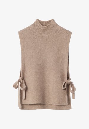 Beige knit sleeveless sweater with a high neck, side ties for closure, soft texture, and a slightly loose fit.