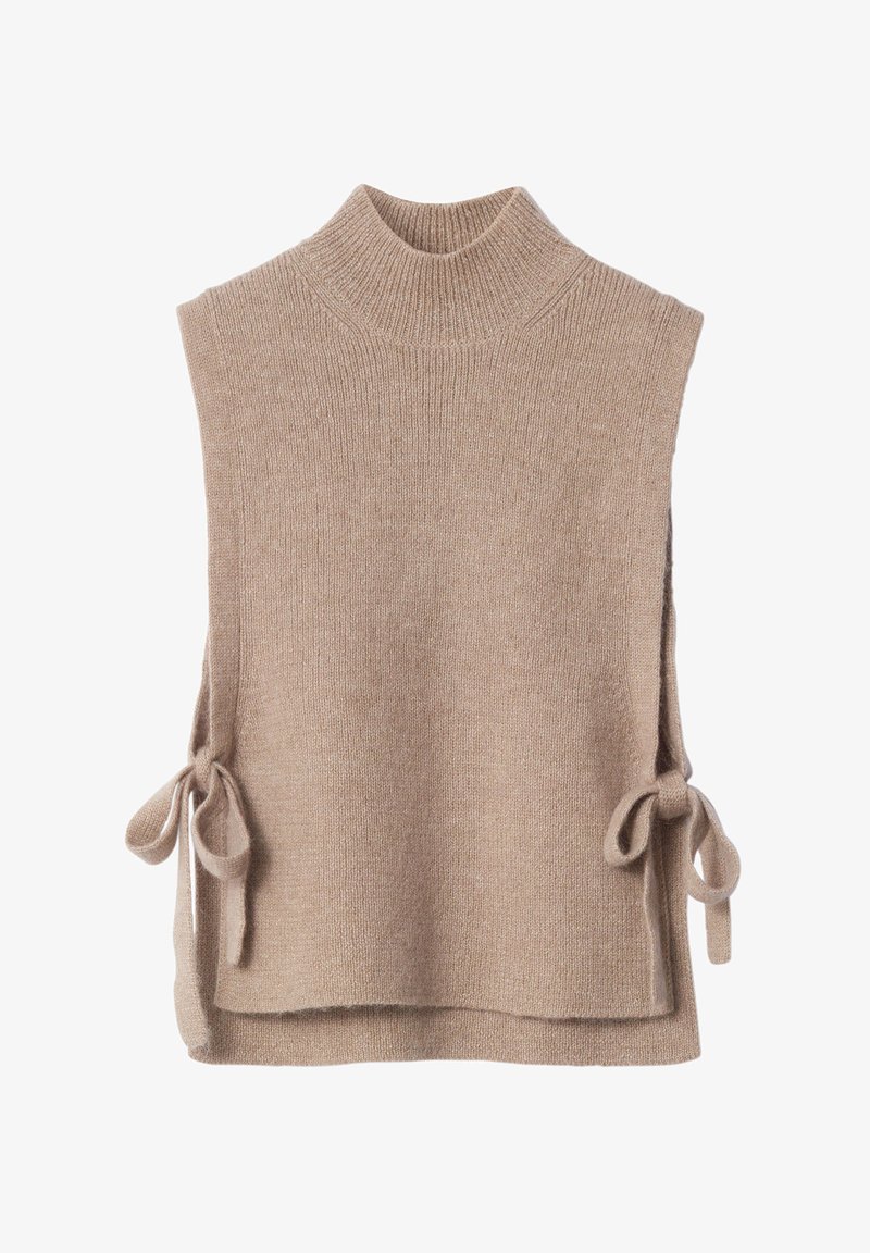 Beige knit sleeveless sweater with a high neck, side ties for closure, soft texture, and a slightly loose fit.