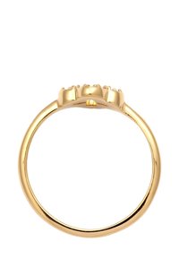 Goldring mit einem glatten, polierten runden Band und einer flachen Oberseite, die mit fünf kleinen, runden, klaren Steinen in einer Reihe besetzt ist.