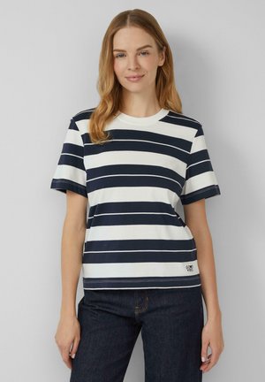T-shirt en coton avec des rayures horizontales bleu marine et blanches, un col rond, des manches courtes et une petite étiquette "Good Vibes" sur l'ourlet.