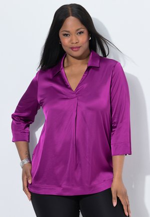 Purple satin blouse with a collar, three-quarter sleeves, and a V-neck design. Features a slightly loose fit and smooth texture.