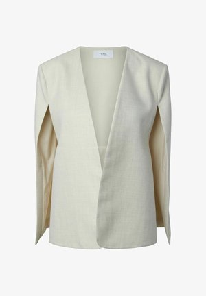 Blejzr krémové barvy s hlubokým V-výstřihem, strukturovanými rameny a otevřeným předním dílem, položený rovně s viditelnou značkou YAS na vnitřní straně límce.