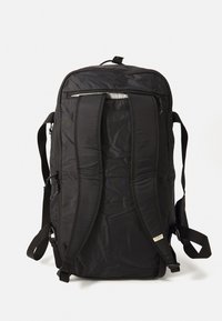 Black backpack made from durable fabric, featuring adjustable straps, a top handle, and a zippered front pocket for storage.