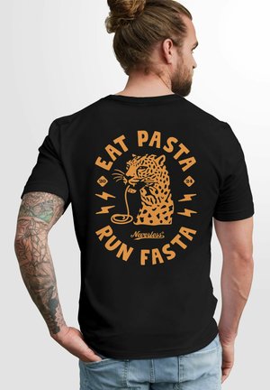 Black t-shirt featuring a leopard graphic eating pasta, with the text "EAT PASTA RUN FASTA" in orange, circular layout, and lightning accents.