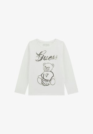 Weißes Langarmshirt aus Bio-Baumwolle mit Paillettenschriftzug "Guess" und Bärenmotiv auf der Vorderseite.