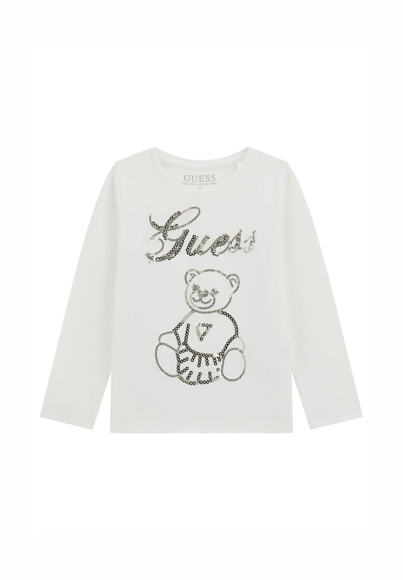Camicia bianca a maniche lunghe con testo in paillettes "Guess" e design di un orsacchiotto sul davanti, realizzata in fibra di cotone biologico.