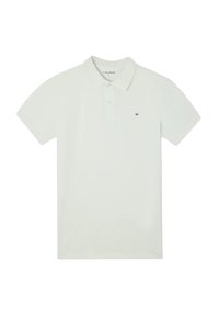 Polo in cotone beige chiaro con colletto, maniche corte e un piccolo logo scuro sul lato sinistro del petto. Design semplice e minimalista.