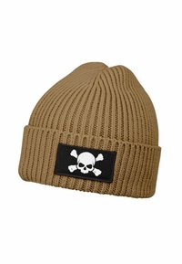 Tan knitted beanie with a ribbed texture, featuring a black patch displaying a white skull and crossbones design.