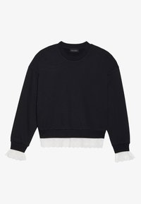 Sweat-shirt noir avec une finition texturée, orné d'une bordure en dentelle blanche sur l'ourlet et les poignets. Col rond et manches longues.