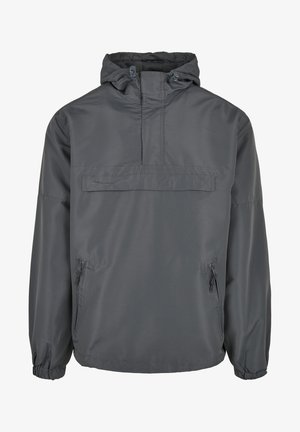 Dark gray windbreaker jacket featuring a half-zip front, adjustable hood, and two zippered side pockets. Elastic cuffs for a snug fit.