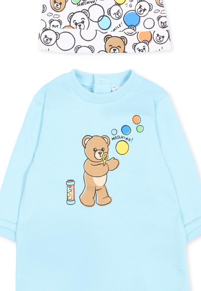 Tutina azzurro chiaro per neonati con orsetto che soffia bolle colorate e tessuto bianco abbinato con volti di orsetti e motivo a bolle.