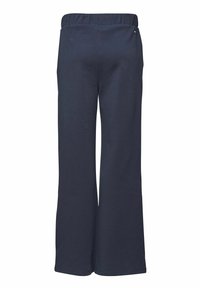 Tumši zilas platas kājas bikses, izgatavotas no mīksta audiem, ar elastīgu jostu. Iezīmē plakanas šuves un bez redzamām kabatām.