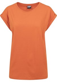 Oranžové tričko s kulatým výstřihem, ohrnutými krátkými rukávy a volným střihem. Vyrobeno z měkké bavlny s hladkou strukturou.