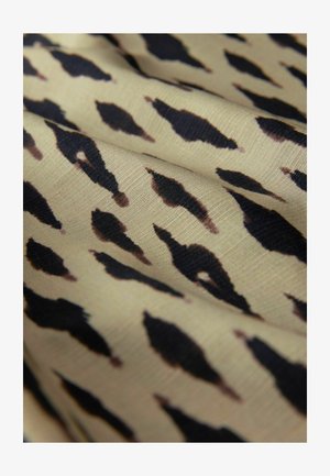 Tessuto con base beige caratterizzato da un motivo ripetitivo di forme nere allungate con sottili sfumature marroni, che mette in evidenza una texture e una caduta morbide.