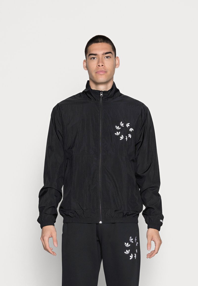 veste adidas noir et blanche