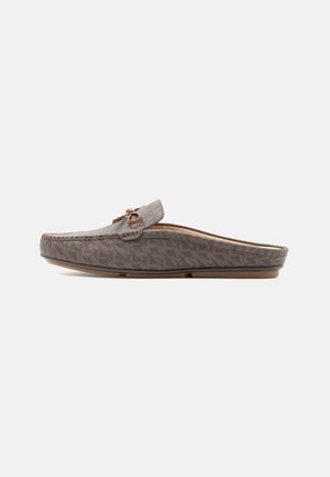 Brown slip-on loafer with patterned fabric, rounded toe, and decorative buckle on top, shown in side profile on white background.