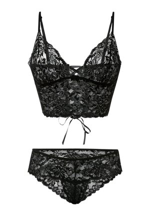 Bralette en dentelle noire avec bretelles ajustables et un lien à l'avant, accompagné de culottes assorties en dentelle ornées de motifs floraux.
