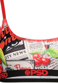 Flerfarget bralette med grafisk trykk med kirsebærmotiver, avispatterner og et rødt elastisk bånd med "PSD"-logo nederst.