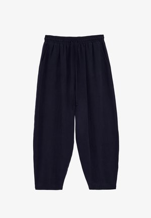 Lockere schwarze kurze Hosen mit elastischem Bund und Kordelzug, mit Seitentaschen und lässigem Stil.