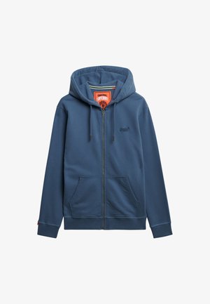 Sudadera azul con cremallera, capucha con cordón, bolsillos frontales y un sutil detalle de logo. Fabricada en una suave y cómoda tela con puños acanalados.