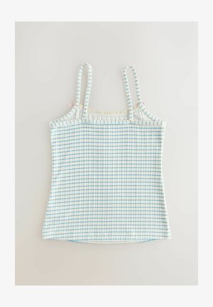 Ljusblå och vit rutmönstrad linne med tunna axelband. Har ett texturerat tyg och kontrasterande spetsdetaljer längs halsringningen.