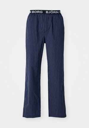 Navy blue pajama pants with vertical white stripes, elastic waistband featuring 'BJÖRN BORG' logo, relaxed fit, tapered leg design.