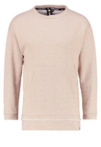 Béžová mikina s dlouhými rukávy, kulatým výstřihem a přední kapsou. Má texturovanou látku a dekorativně prošívaný lem.