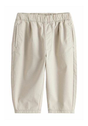Lyse beige knælange shorts med elastisk talje og sidelommer, vist mod en hvid baggrund.