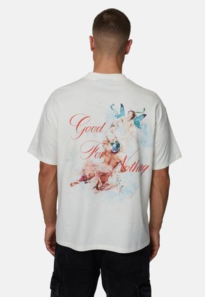 Biała bawełniana koszulka z dużym, kolorowym nadrukiem na plecach, z napisem "Good For Nothing" w czerwonym kolorze. Krótkie rękawy i luźny krój.