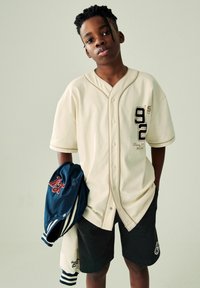 Next VARSITY SET  - REGULAR FIT - Printtipaita - cream black