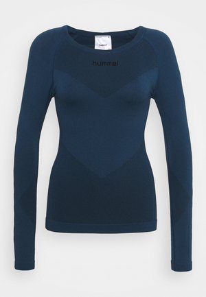 Long-sleeve top in dark blue, featuring textured stripes and a fitted design. The brand logo is displayed on the chest.