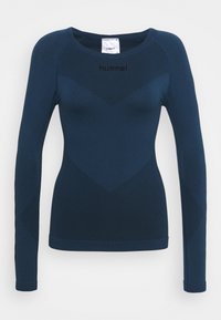 Navy blue long-sleeve athletic top with textured chevron patterns and "hummel" logo on the chest.