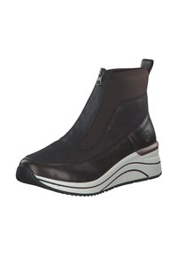 Bottines noires et marron avec une tige en cuir lisse, des côtés élastiques, une languette à l'arrière et une épaisse semelle blanche au design courbé.