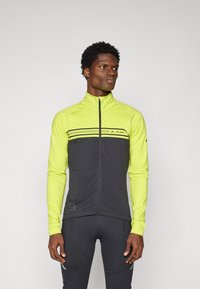 Herren-Fahrradjacke in strahlend Gelb und Dunkelgrau. Mit hohem Kragen, durchgehendem Reißverschluss und horizontalen Streifen über der Brust.