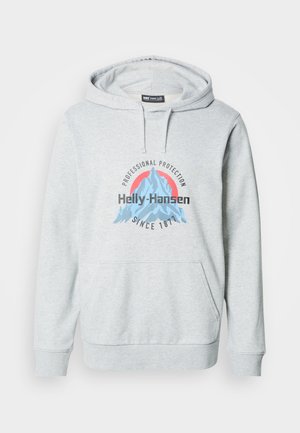 Sudadera con capucha de color gris claro con bolsillo frontal, que presenta un logo gráfico en azul y rosa con el texto "Protección Profesional" y "Helly-Hansen".